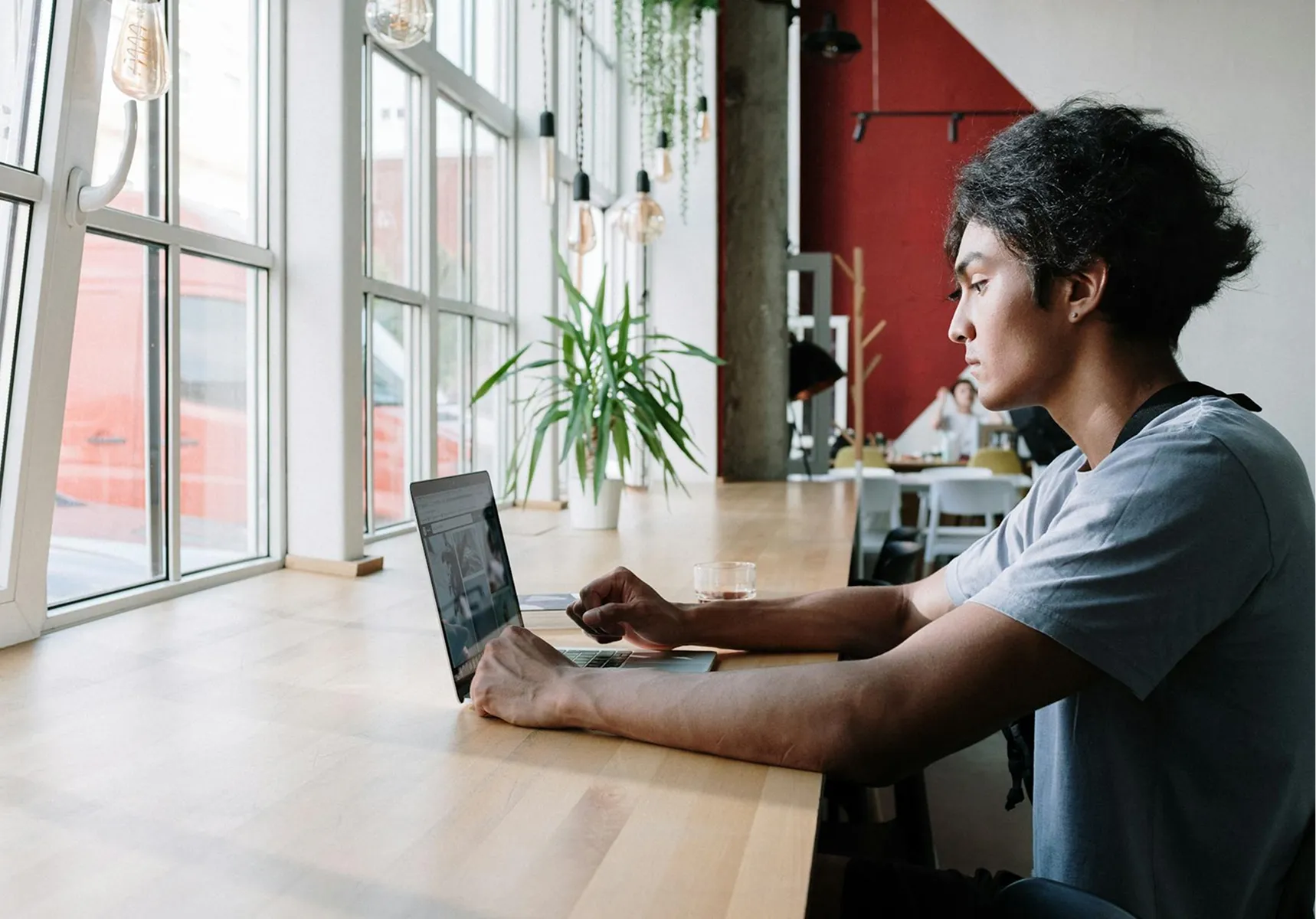 A person working independently at a laptop